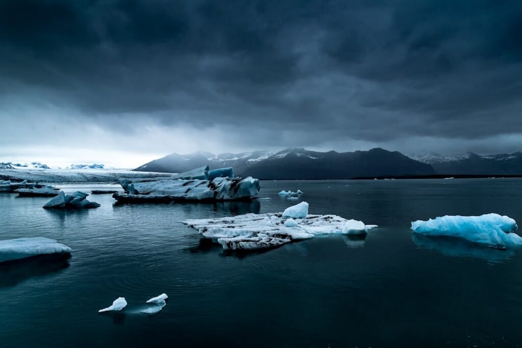 glacier near body of water