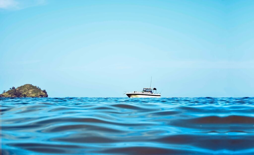 white boat and body of water